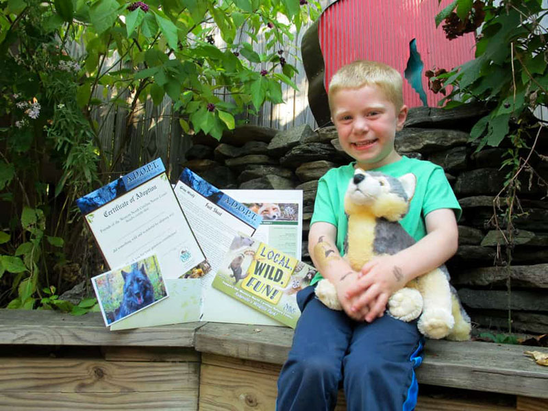 Happy kid with his adoption package